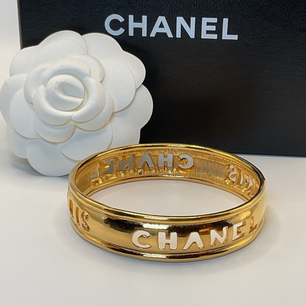 CHANEL Gold Cut Out Logo Bangle
